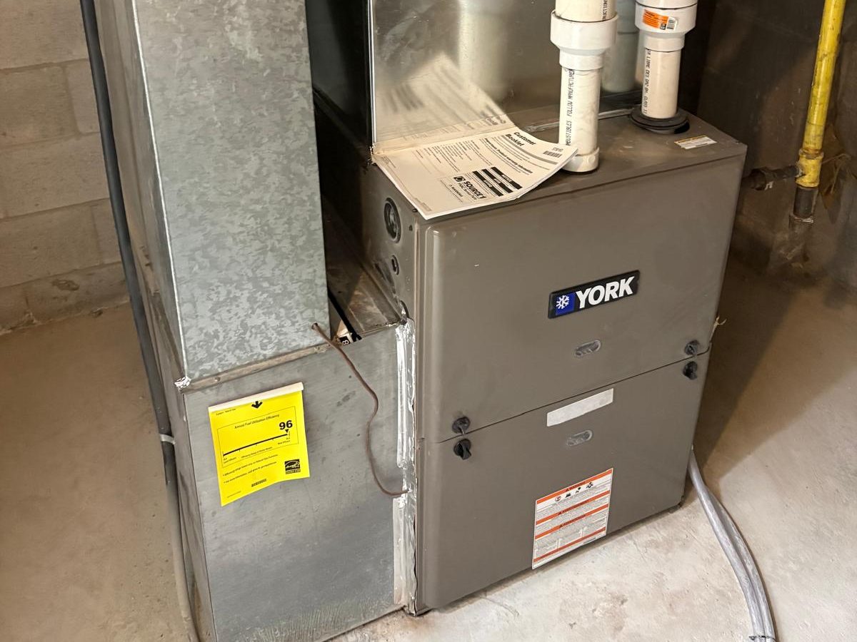 High-efficiency gas furnace installed in a basement
